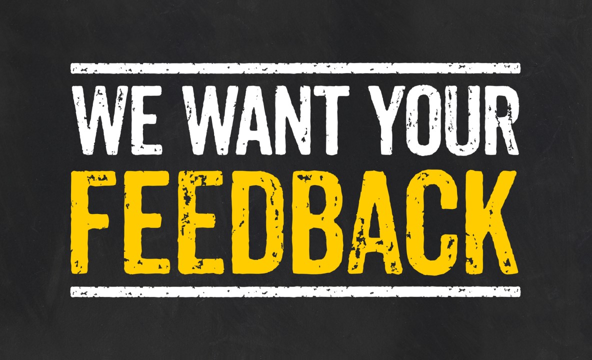 A sign that says We want Your Feedback